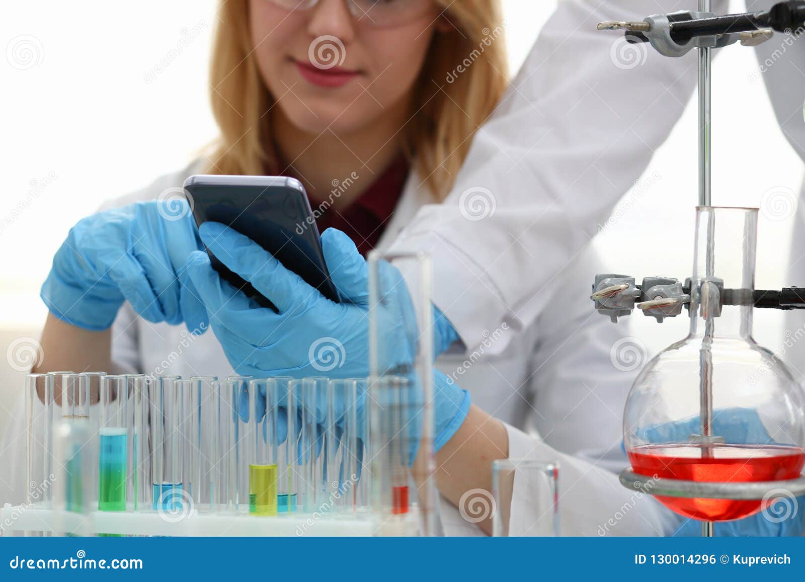 A Female Doctor in a Chemical Laboratory Holds Stock Photo - Image of ...