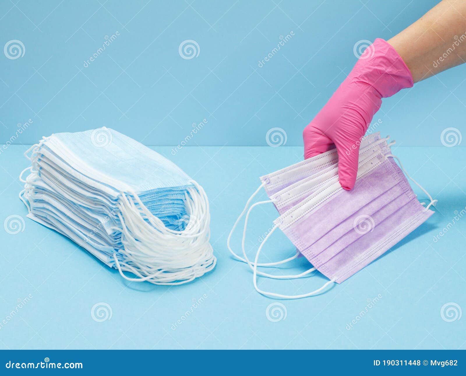 Female Doctor in a Glove Holding Medical Masks in Hir Hand Stock Photo ...