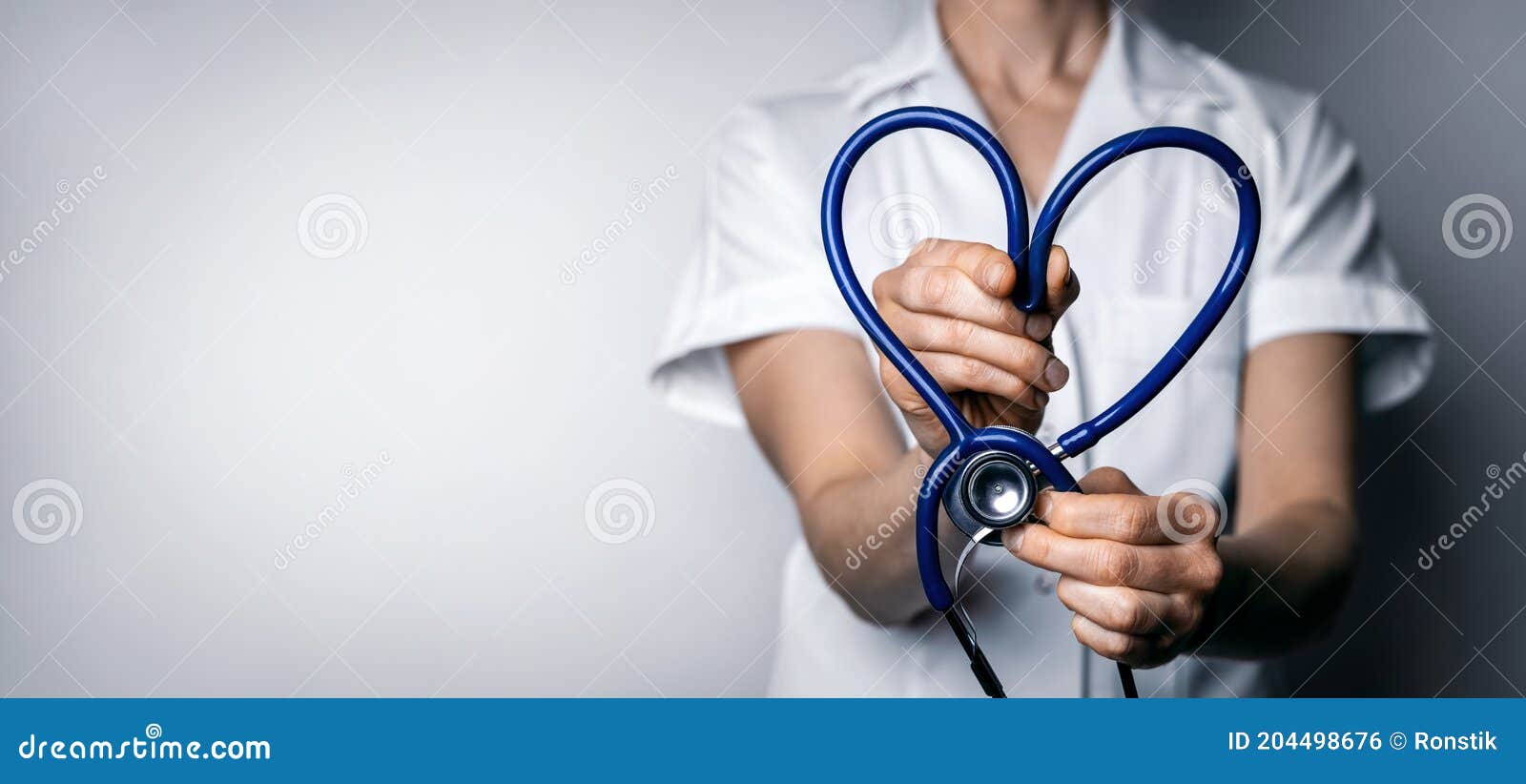 female doctor with heart d stethoscope. healthcare job love, cardiology or health insurance concept. copy space