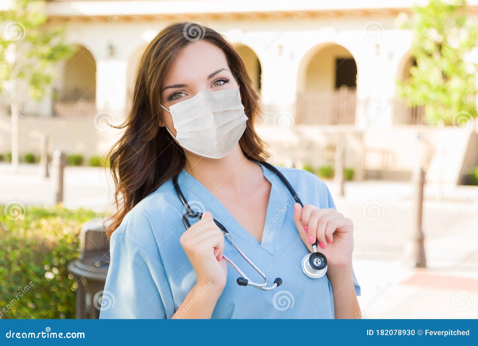 Female Doctor or Nurse Wearing Protective Face Mask Stock Photo - Image