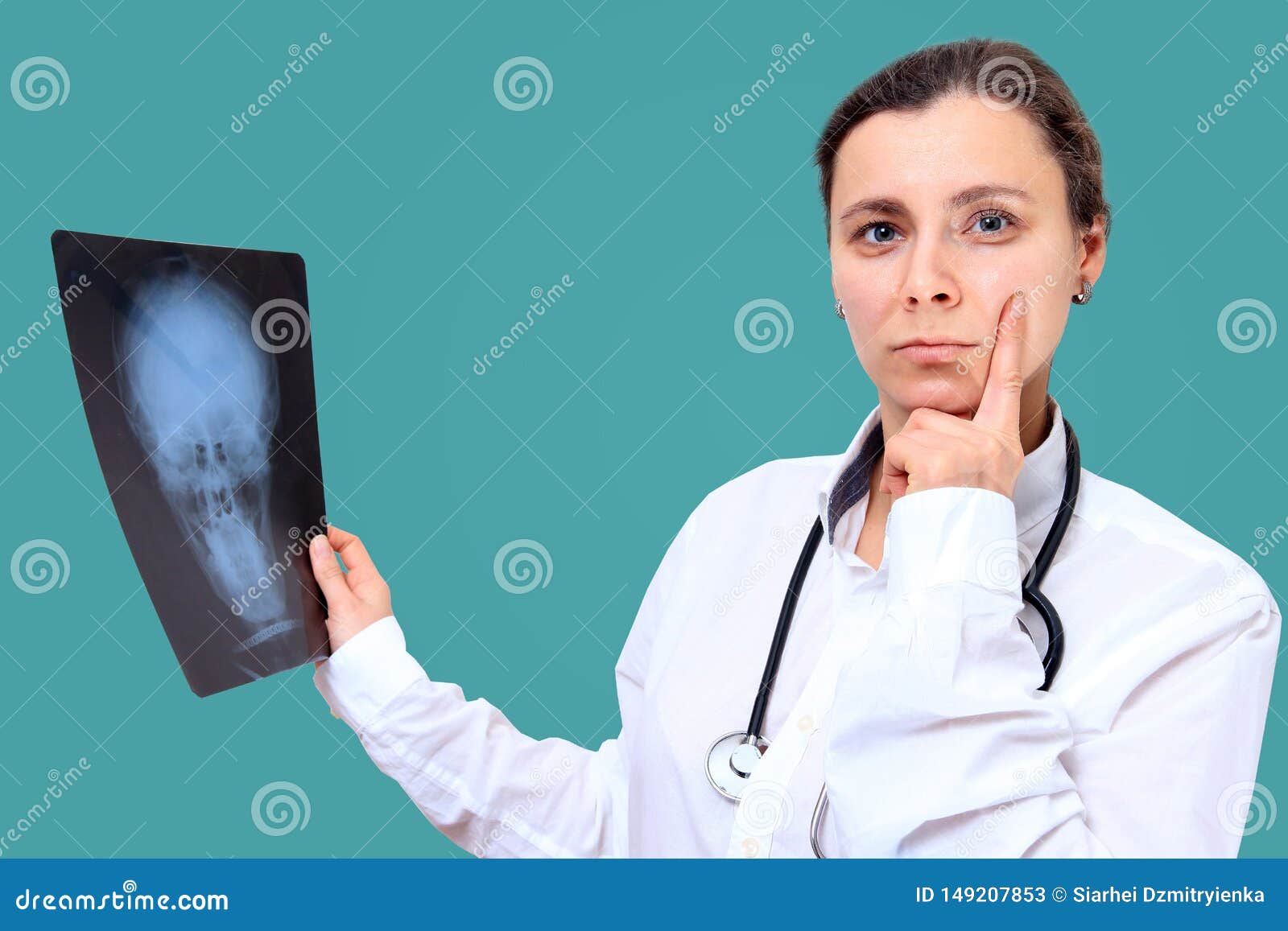 Female Doctor with XRay. Medical Worker Analyzing Xray Image Stock