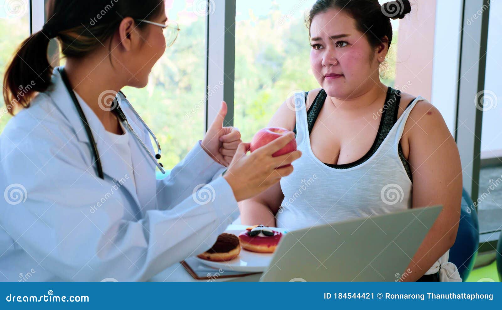Female Doctor Suggesting Chubby Woman To Eat Apple Stock Image Image Of Doughnut Junkfood 