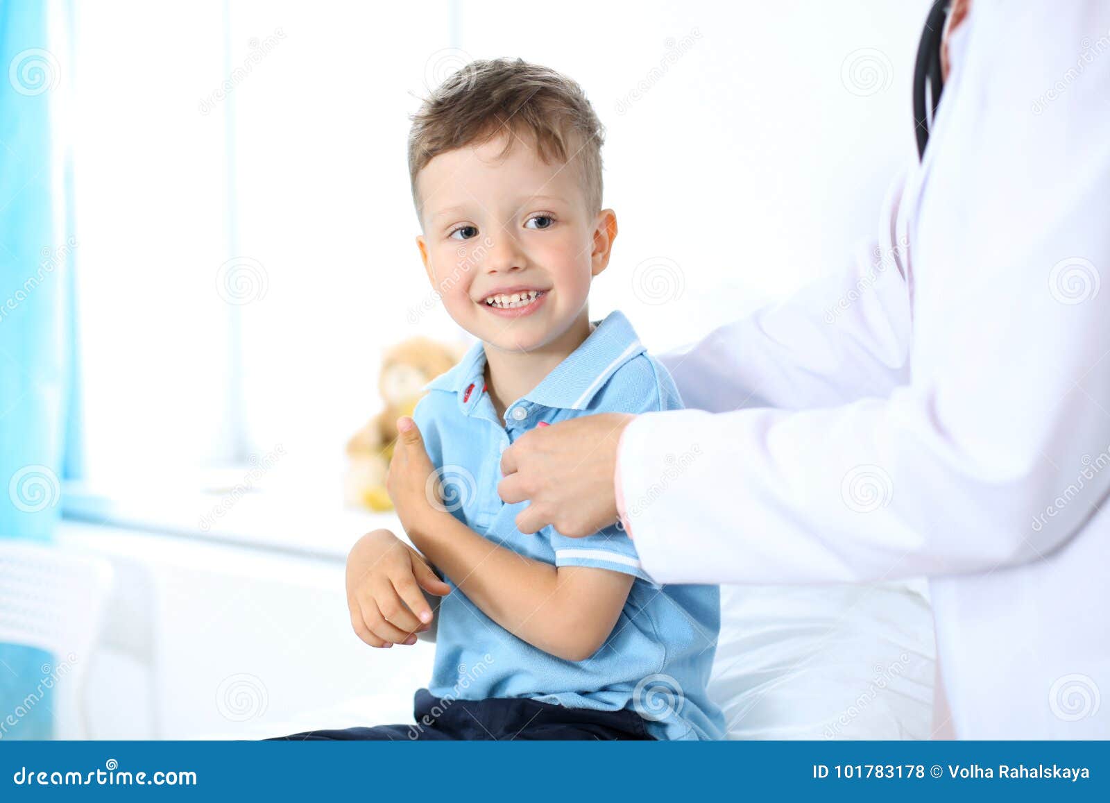 Female doctor using a digital tablet, close-up of hands. Health care concept or children`s therapy.