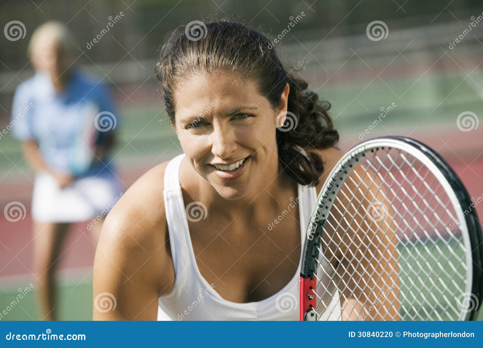 Female Doubles Tennis Players Waiting For Serve Focus On Foreground Close Up Stock Photo Image Of Game Hispanics