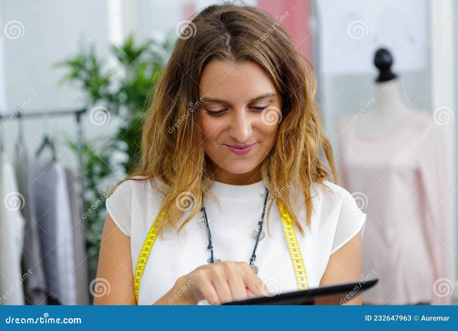Female Dressmaker Using Digital Tablet Stock Image Image of happiness