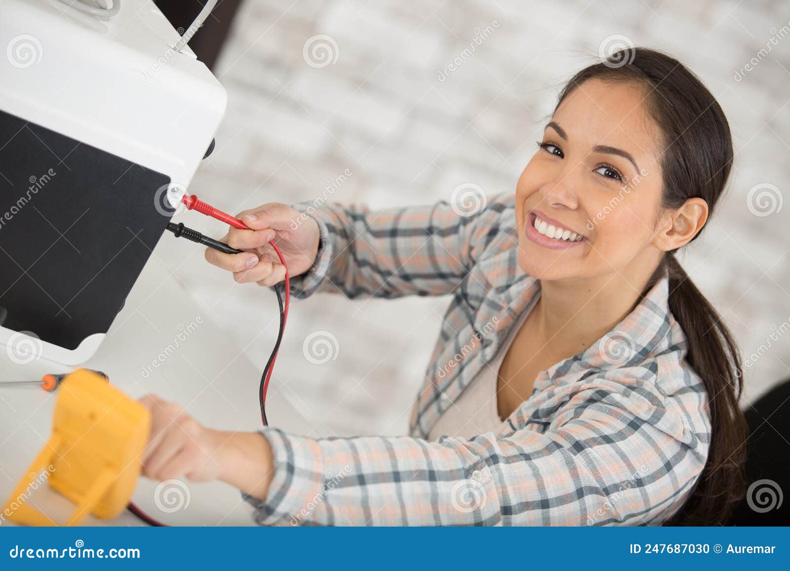 Female electrician at work stock photo. Image of checking 247687030