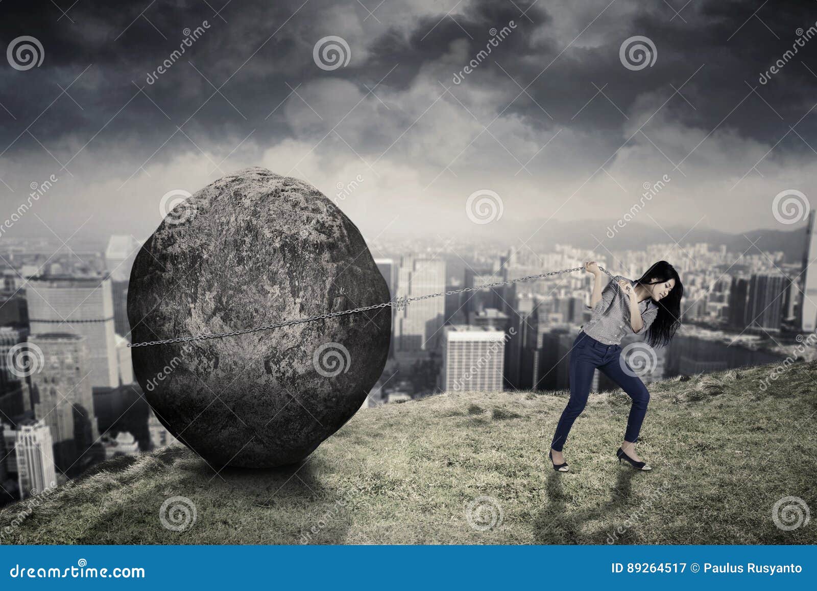 female entrepreneur with big stone on the hill