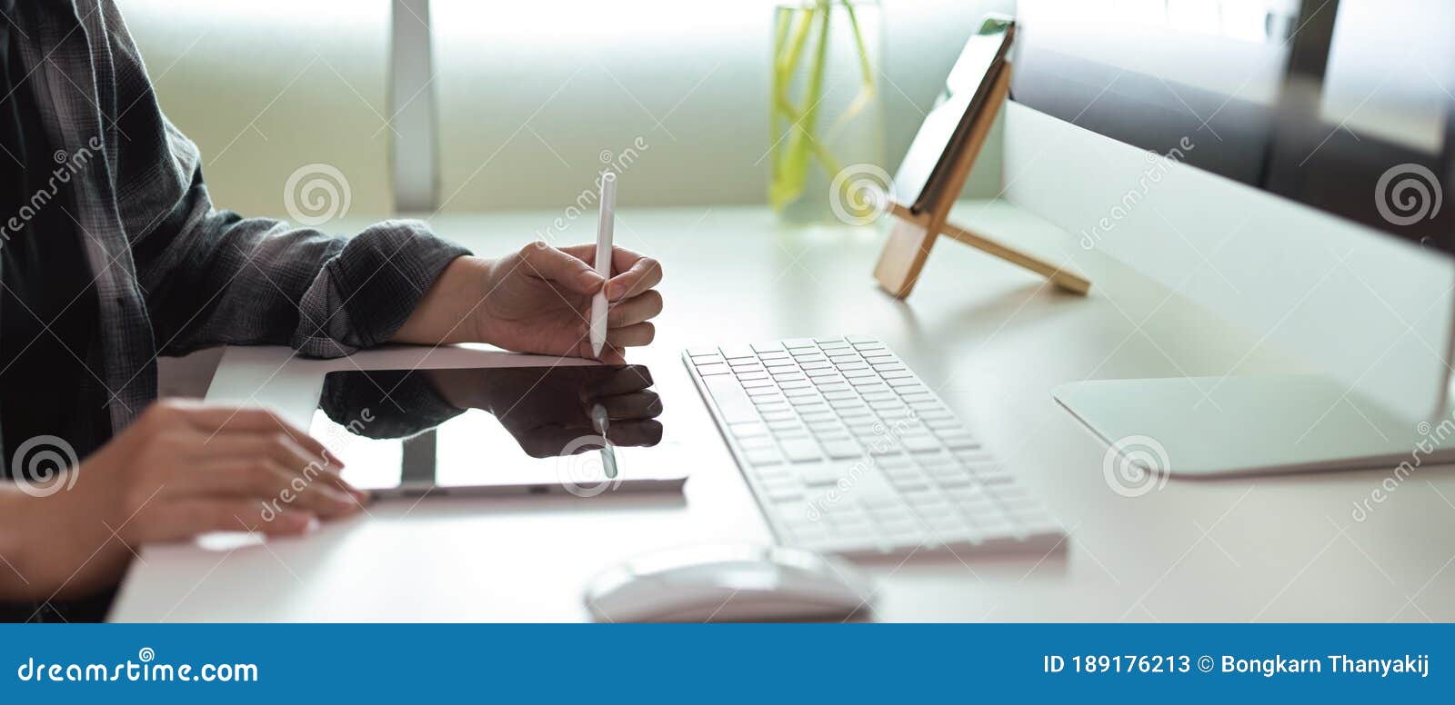 Female Entrepreneur Using Digital Tablet with Stylus on White Office