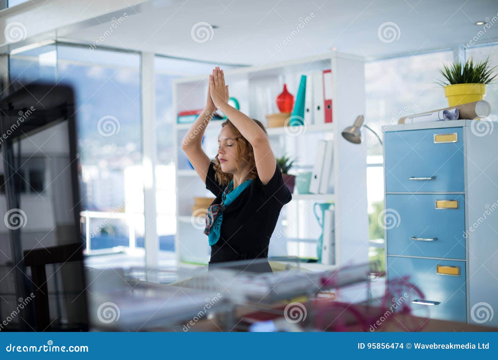 Female Executive Doing Yoga In Office Stock Photo Image Of