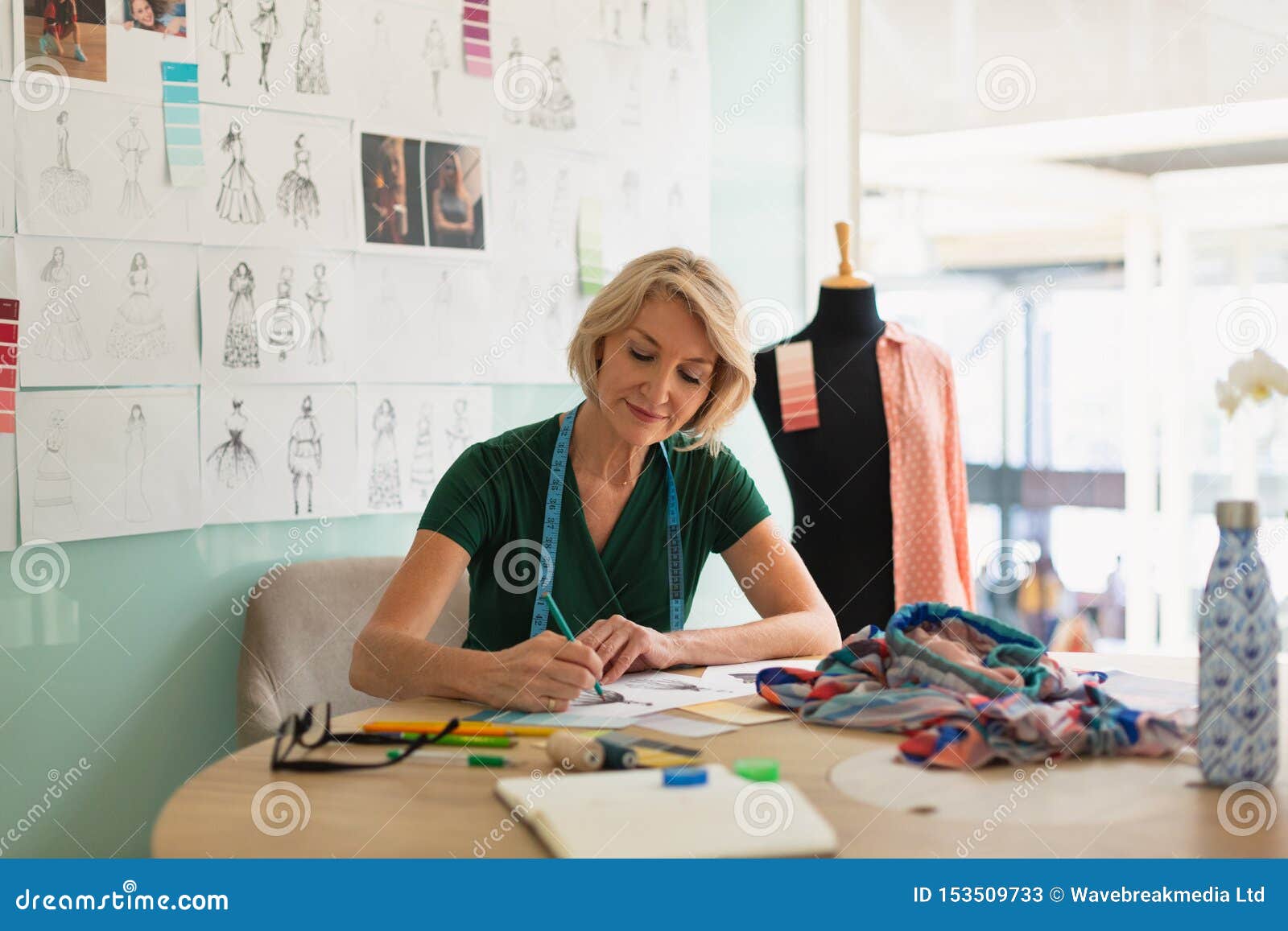 Female Fashion Designer Drawing a Sketch on a Table Stock Image - Image ...