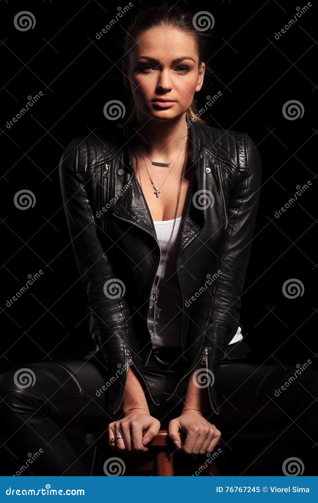 Female Fashion Model in Leather Jacket is Sitiing on Chair Stock Image ...