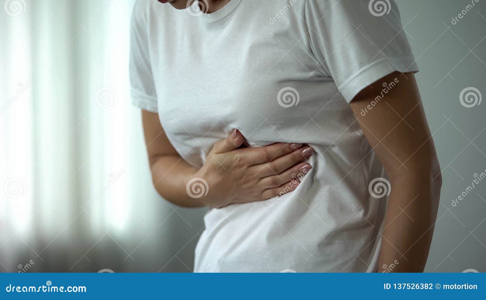 female feeling stomachache, suffering from peptic ulcer, unhealthy eating result
