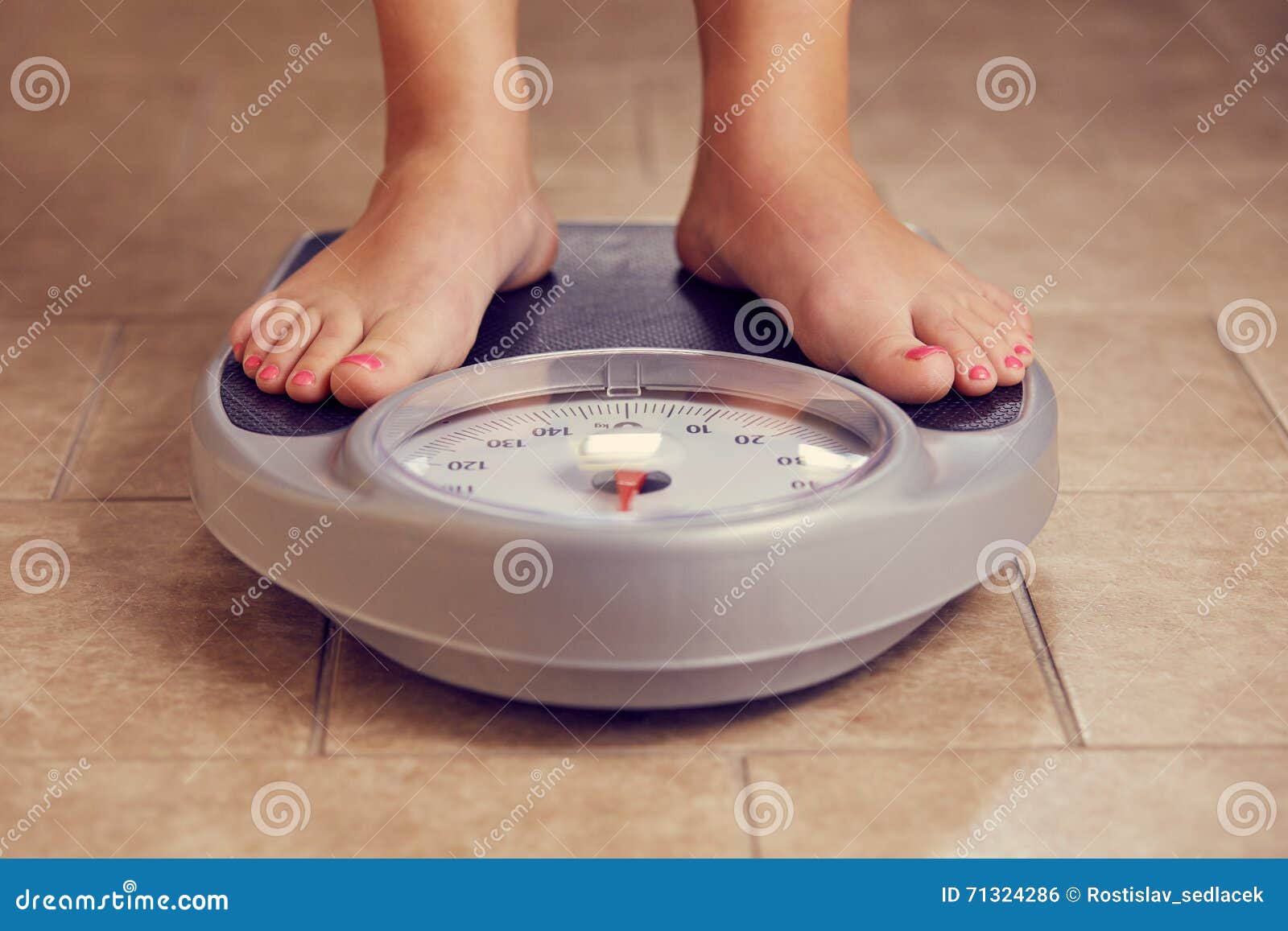 The Feet Of A Woman Standing On Bathroom Scales To Turn Stock Photo,  Picture and Royalty Free Image. Image 11153927.