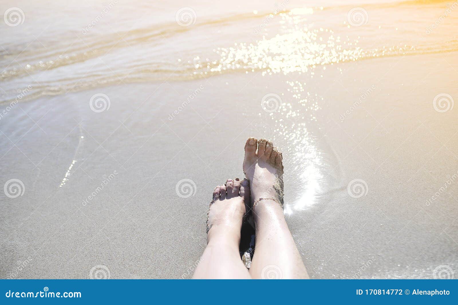 Female feet on the beach. stock photo. Image of coast - 170814772