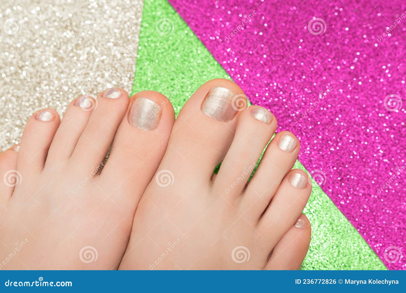 female feet glitter gold nail design glitter gold nail polish pedicure glitter colorfull background pink green female 236772826