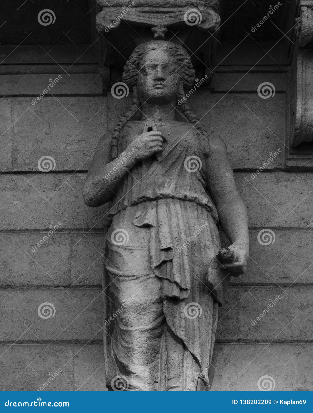 female figure holding the compass