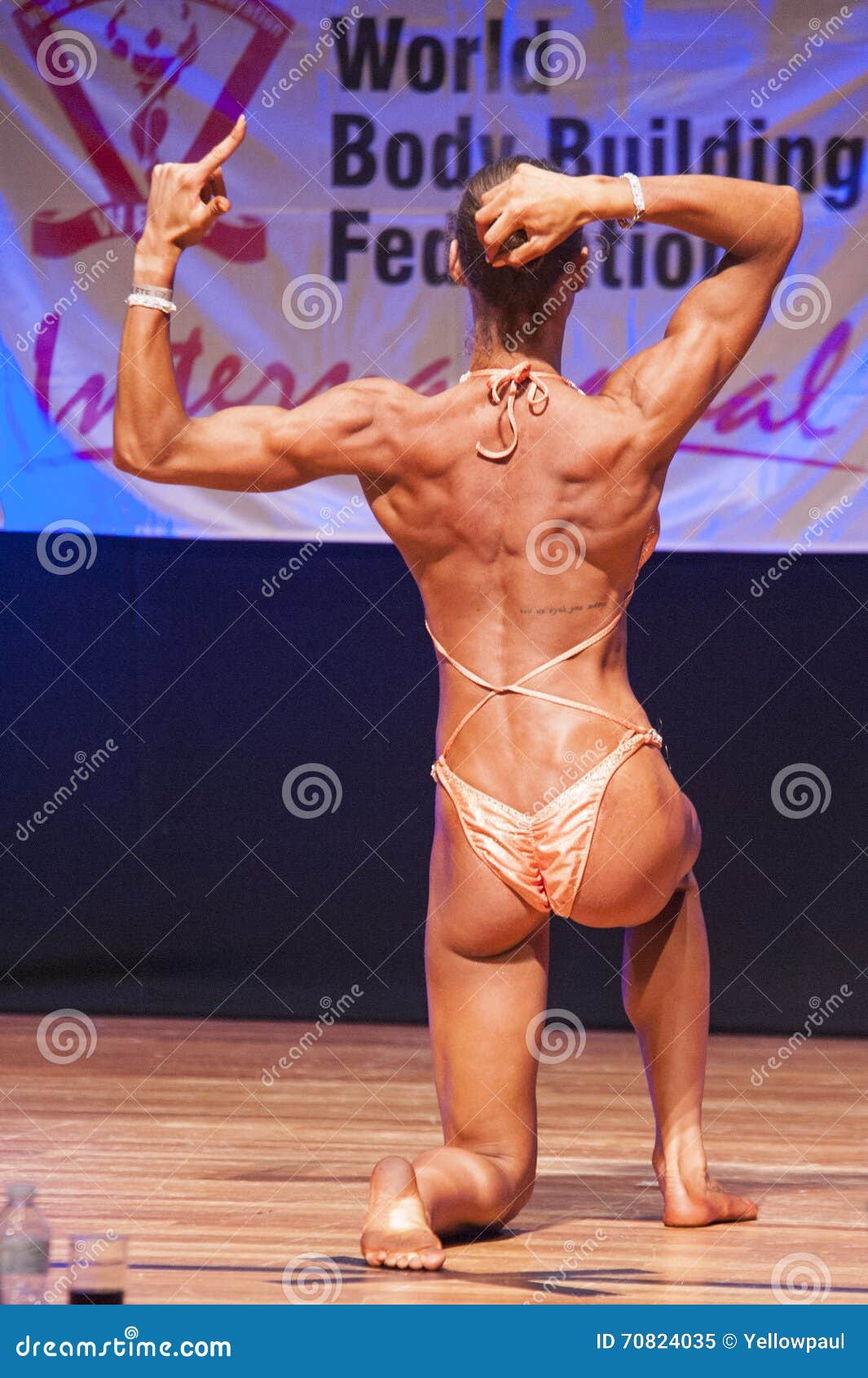 Female Figure Model Flexes Her Muscles and Shows Her Physique Editorial  Image - Image of stage, muscle: 70824035