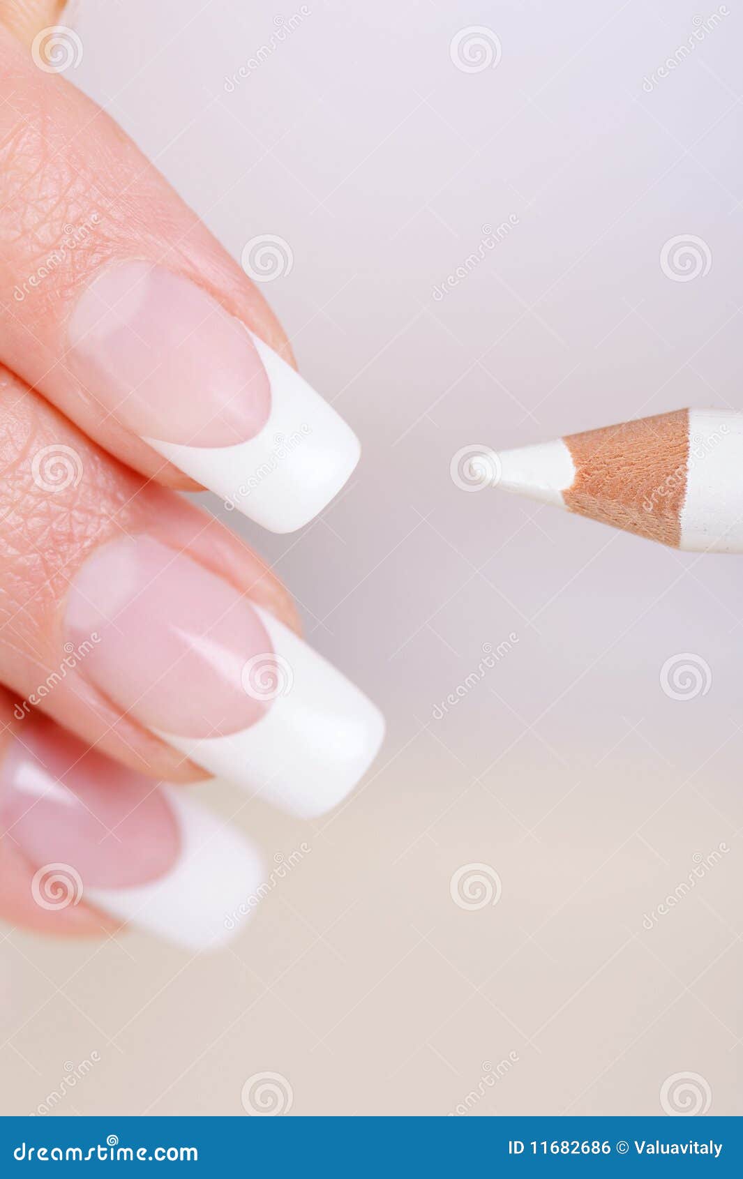 female fingers manicure white pencil 11682686