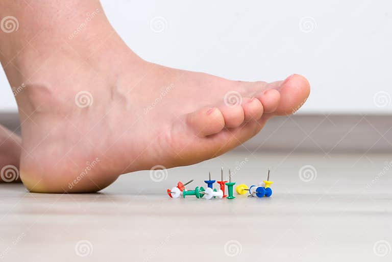 Female Foot Above Colored Pushpin Stock Photo - Image of harm, injured ...