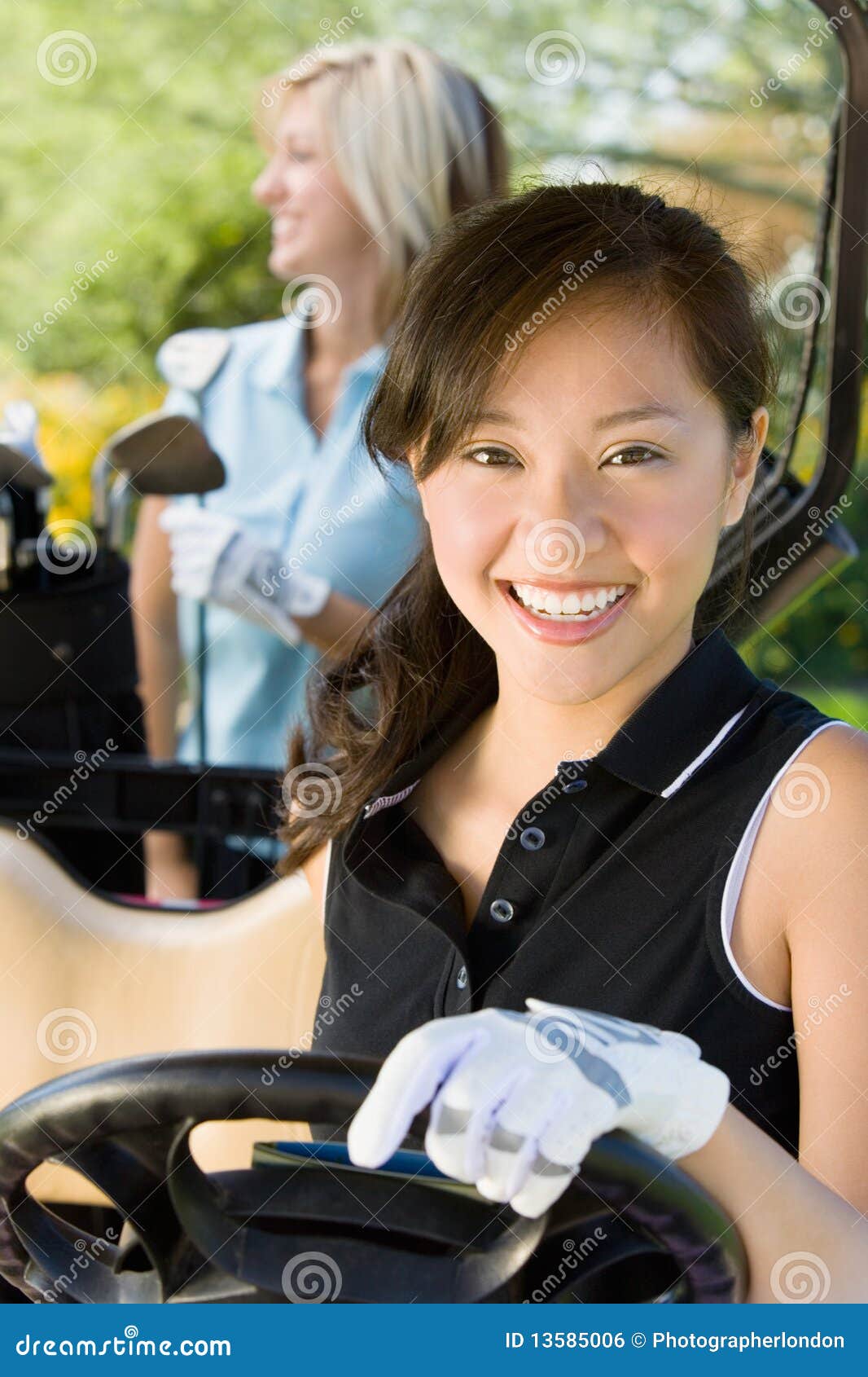 Female golfer in golf cart stock photo. Image of golf 13585006