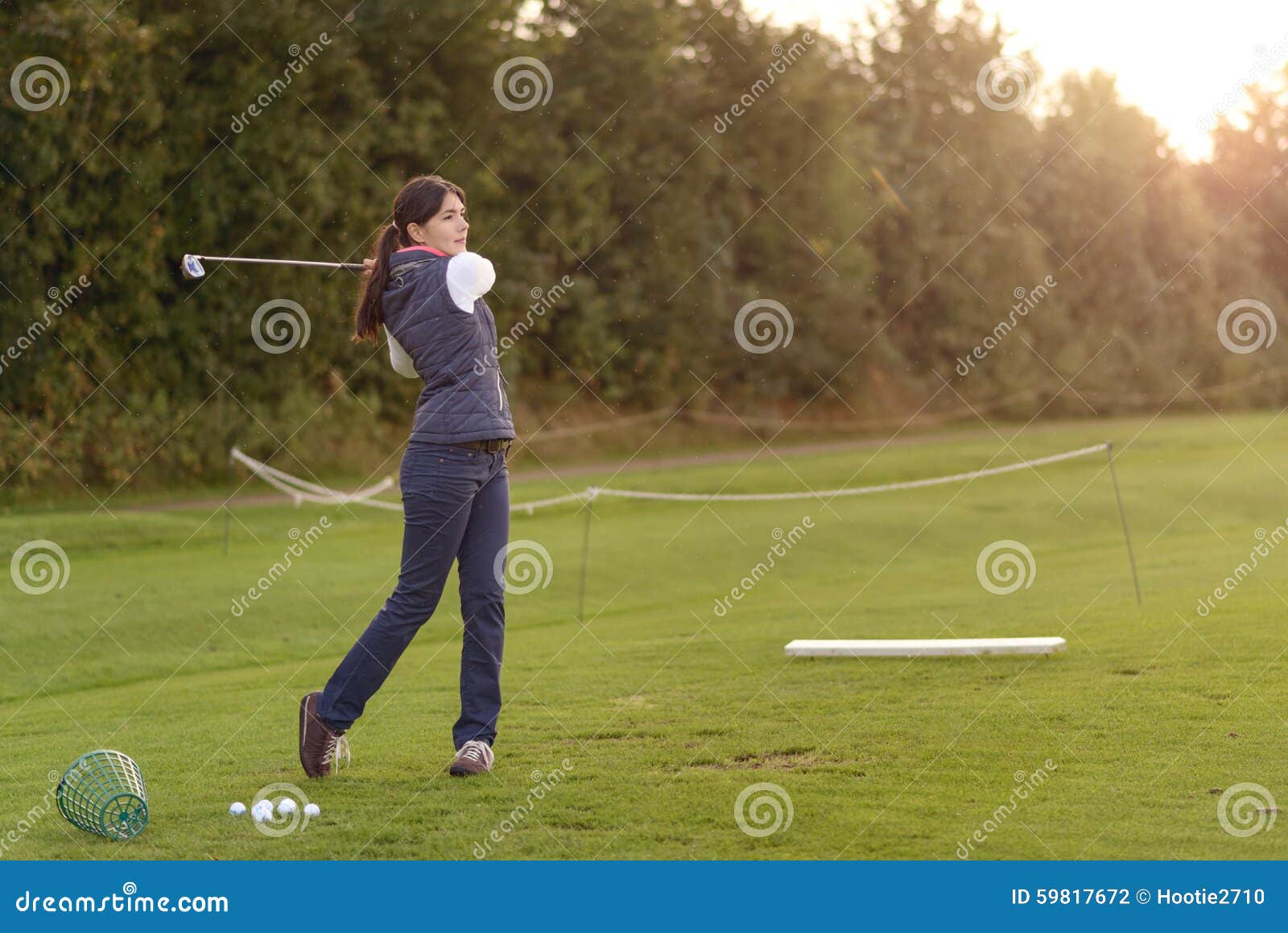 Female Golfer Practicing on a Driving Range Stock Photo Image of