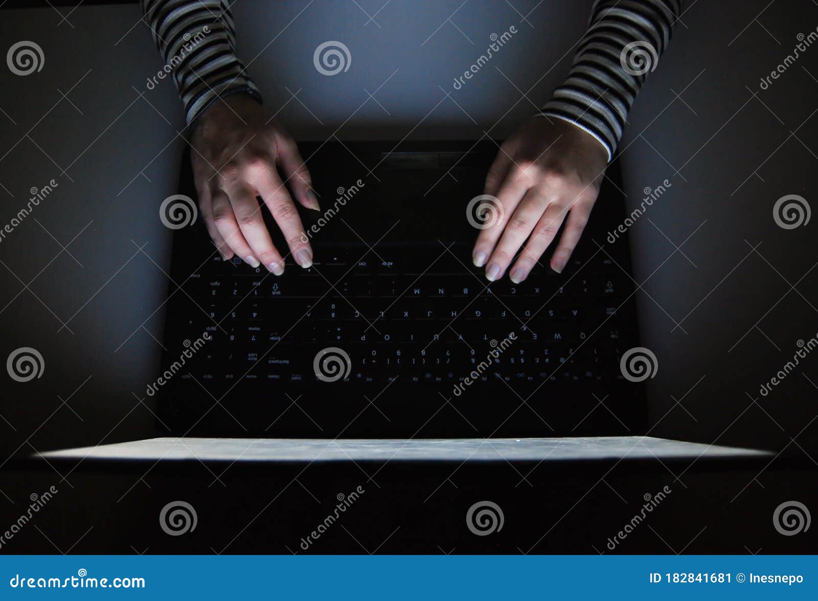 female hacker  typing in a keyboard on a laptop