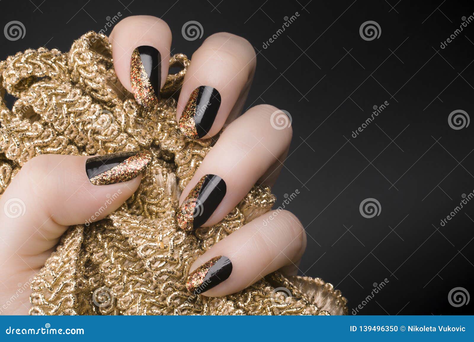 Golden black nails stock photo. Image of background - 139496350