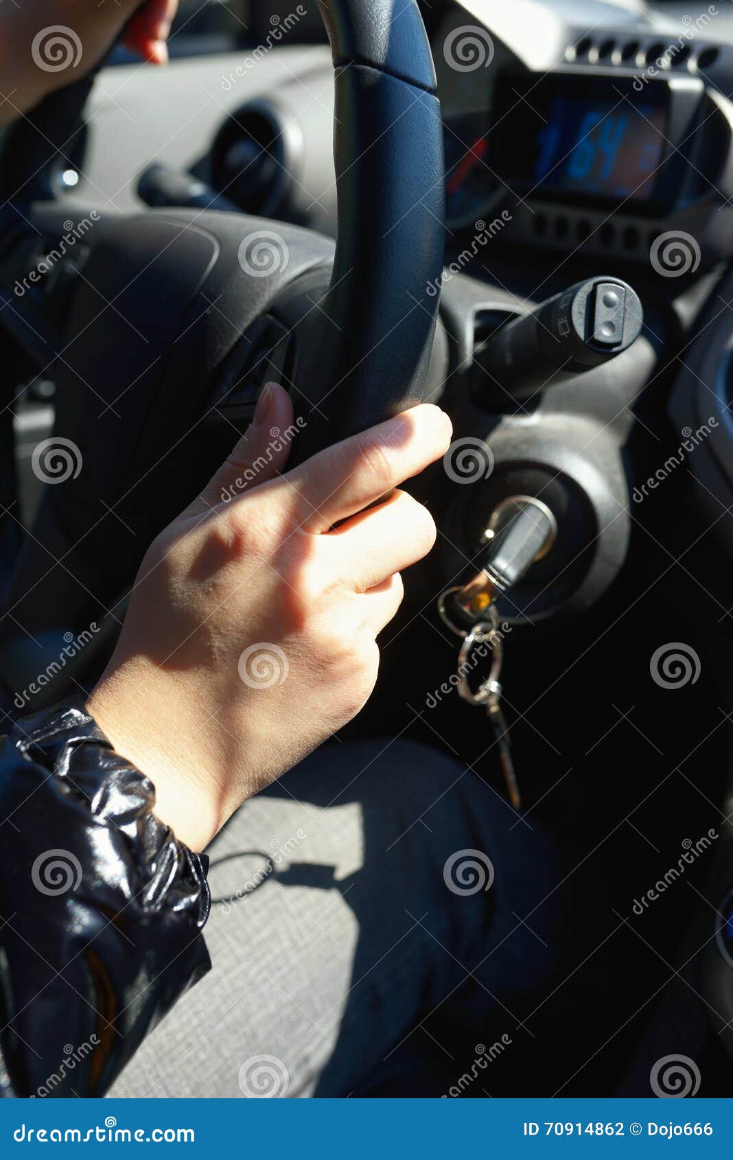 Female hand on a car wheel stock photo. Image of interior 70914862
