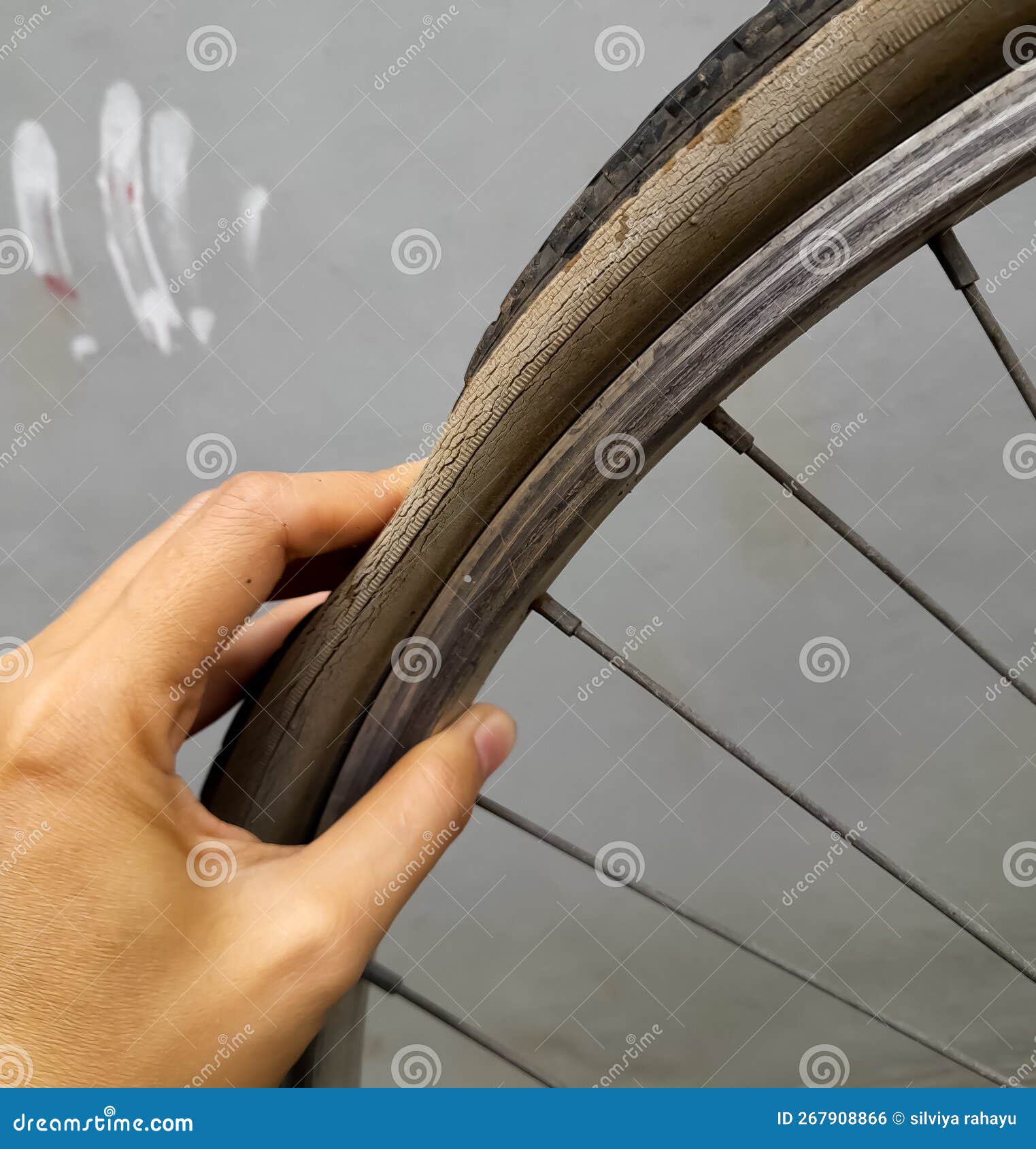 Female Hand Holding a Punctured Bicycle Tire Stock Photo Image of