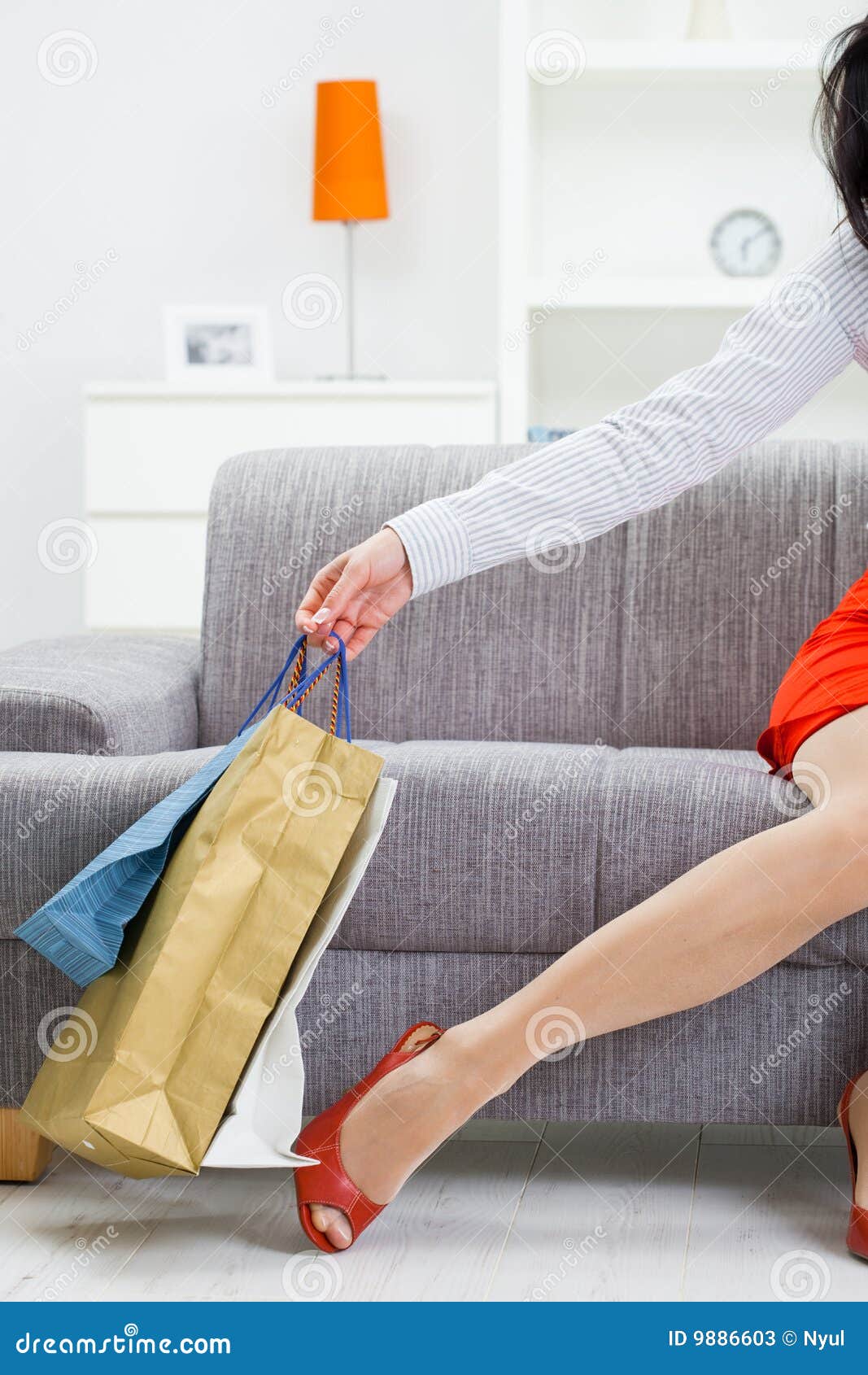 Female Hand Holding Shopping Bags Stock Image - Image of background