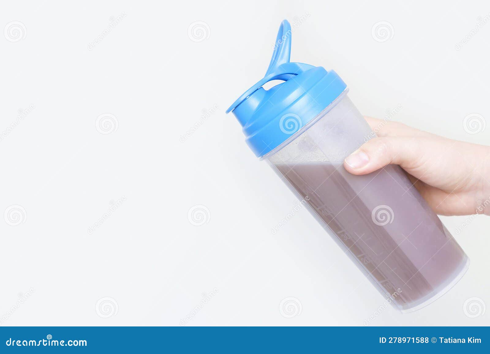 Female Hand Holds Shaker with Protein Shake on White Background. Stock