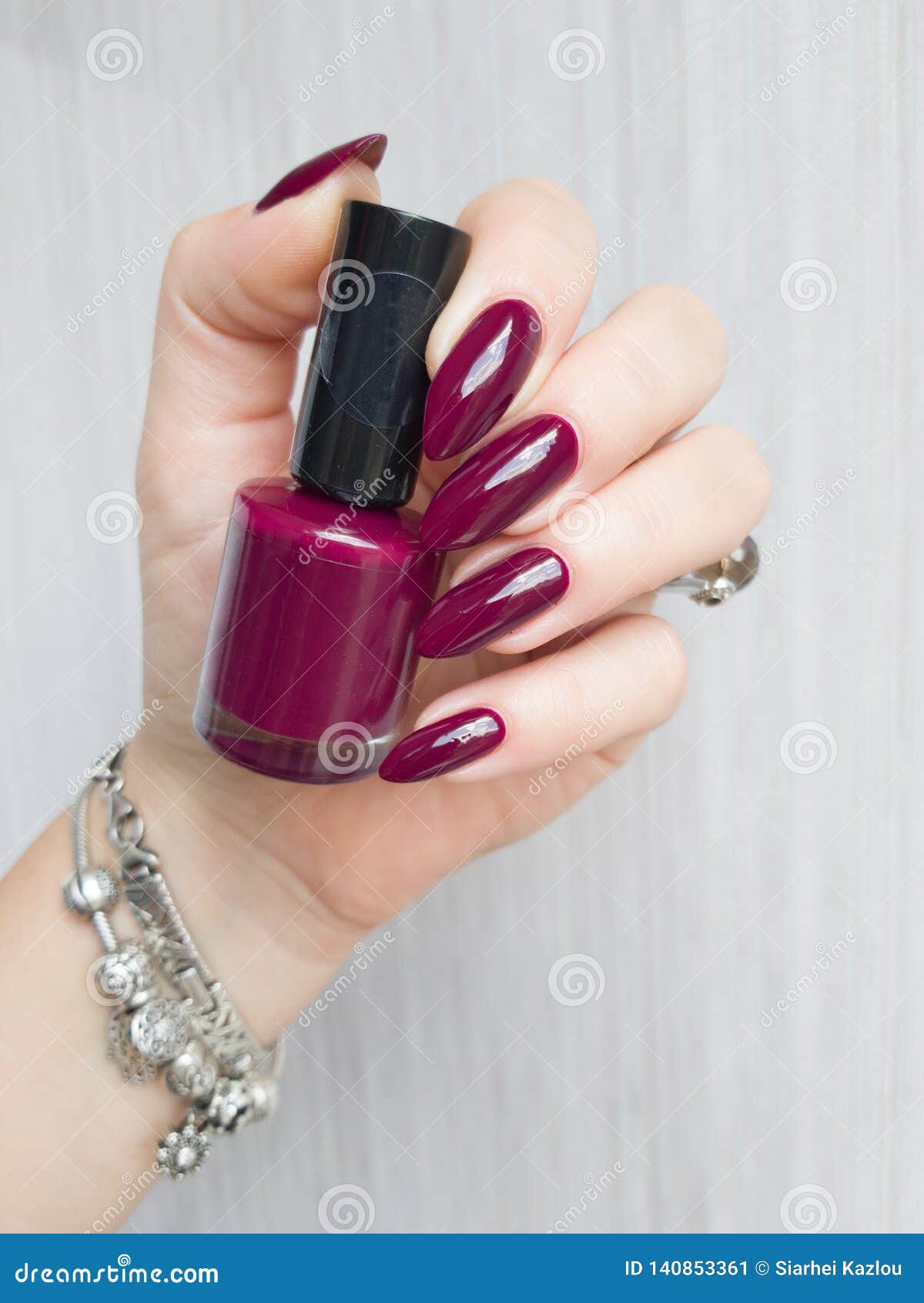 Female Hand with Long Nails Holds a Bottle Nail Polish Stock Image ...