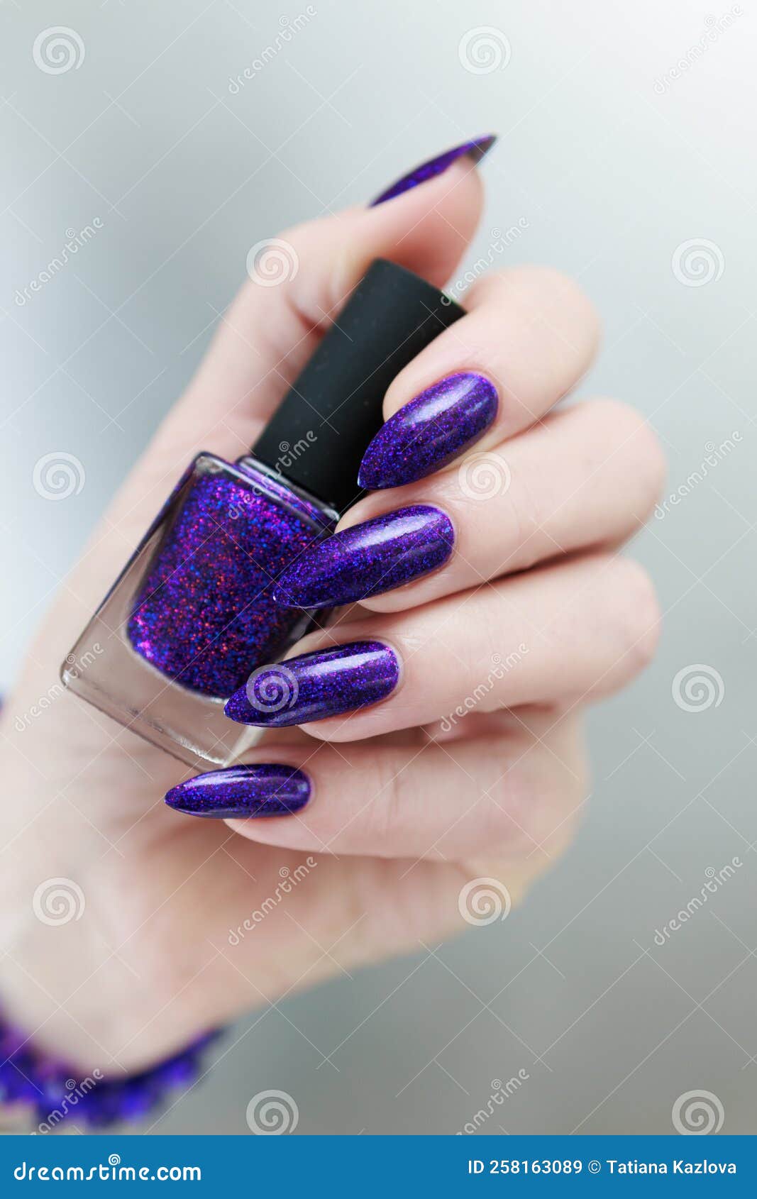 Female Hand with Long Nails and Purple Plum Manicure Stock Image ...