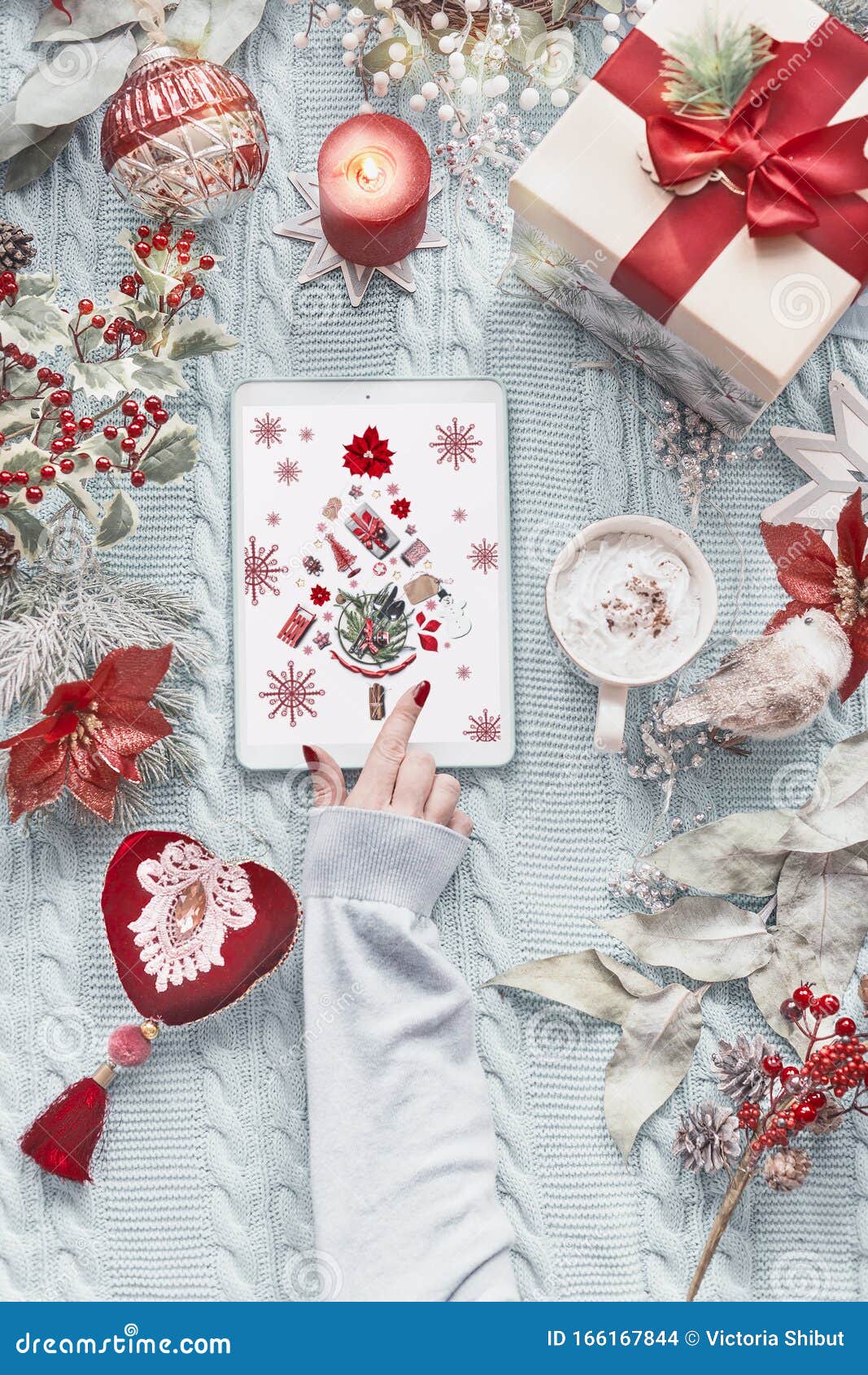 Female Hand Using Tablet Computer with Christmas Tree Greeting Card on ...