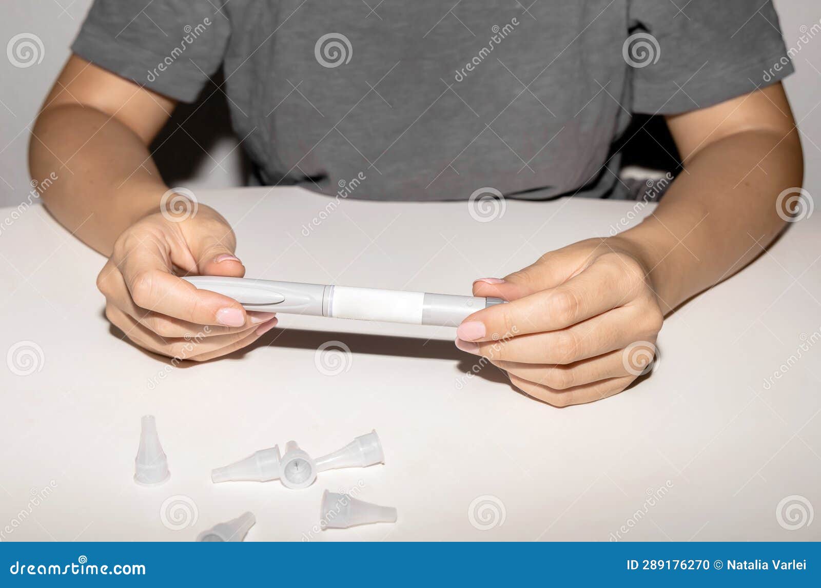 female hands holding an insulin pen. ozempic insulin injection pen.