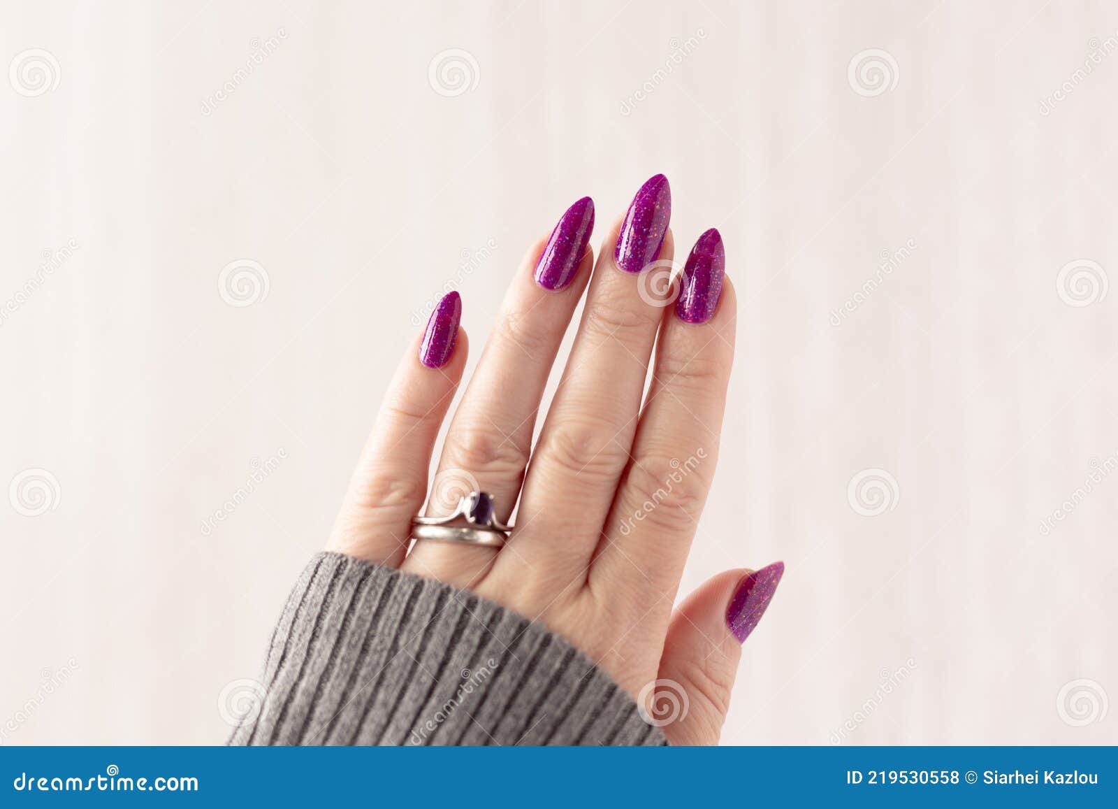 What do long nails say about a woman?