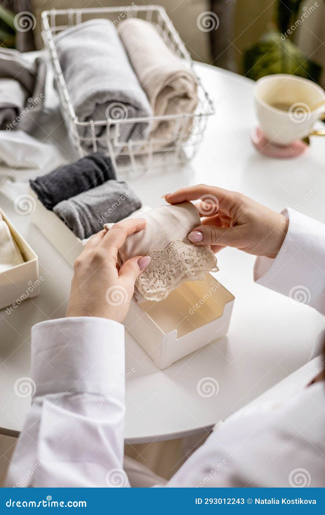 Beautiful Young Caucasian Lady Folds Underwear In The Laundromat Stock  Photo, Picture and Royalty Free Image. Image 10140225.