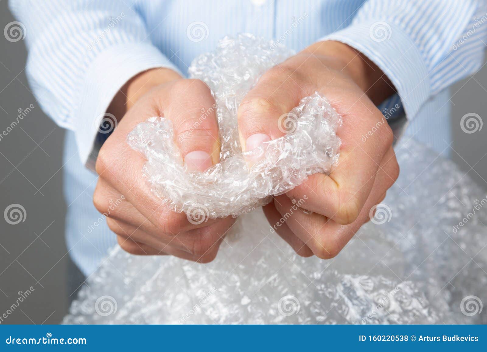 Female Hands Popping The Bubbles Of Bubble Wrap. Stress Relief, Anger