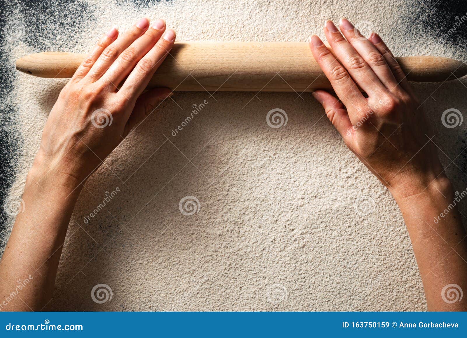 female hands and rolling pin flat lay, bread making concept.