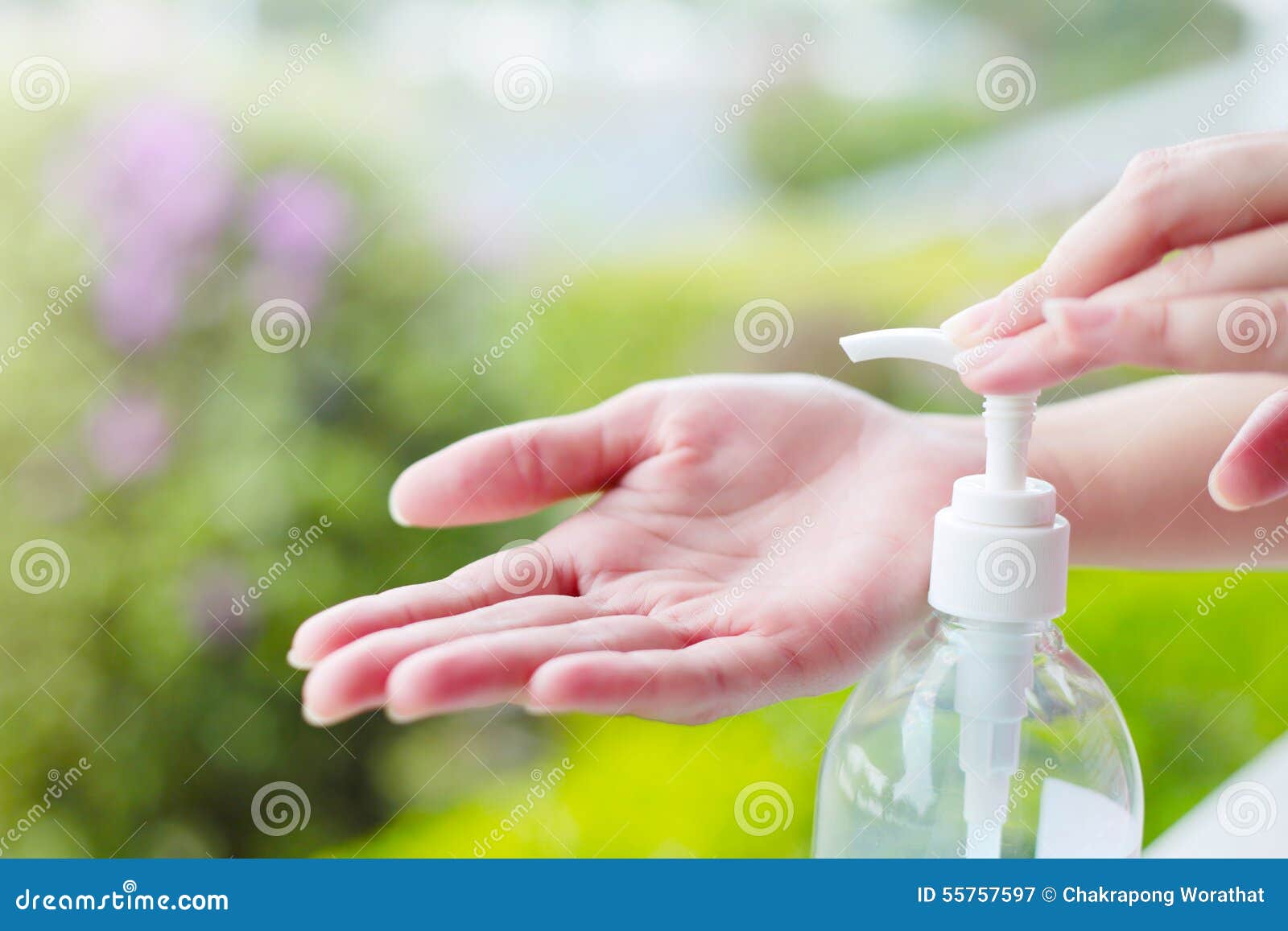 female hands using wash hand sanitizer gel pump dispenser.