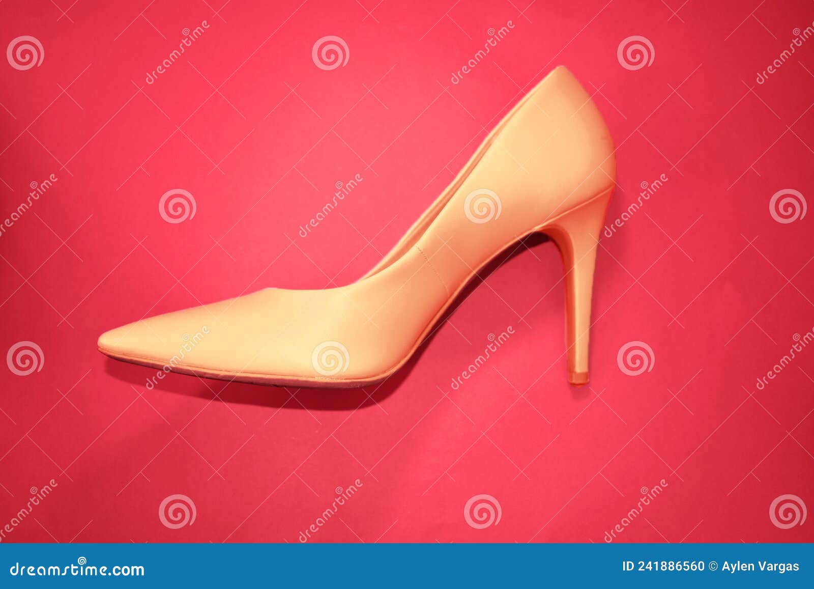 female heels shoes on a red background