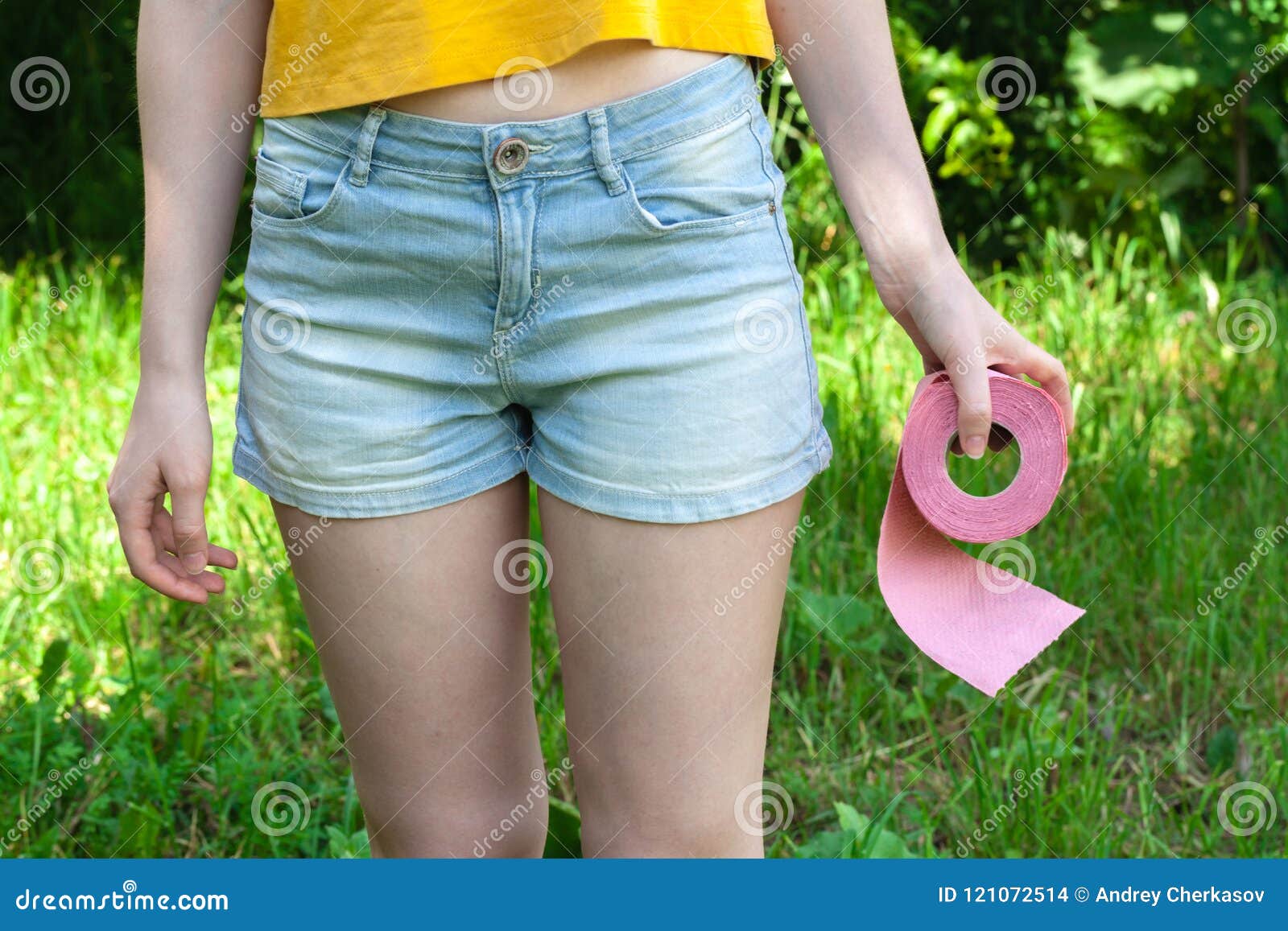 female hold toilet paper outdur nature. concept of diarrhea in summer season