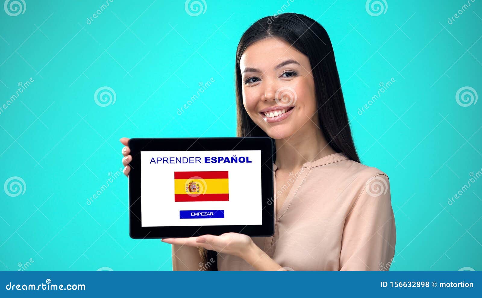 female holding tablet with learn spanish application, ready to start course