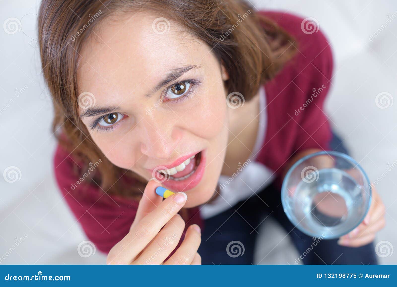 Female Holding Water and Pills Stock Image Image of awake, room