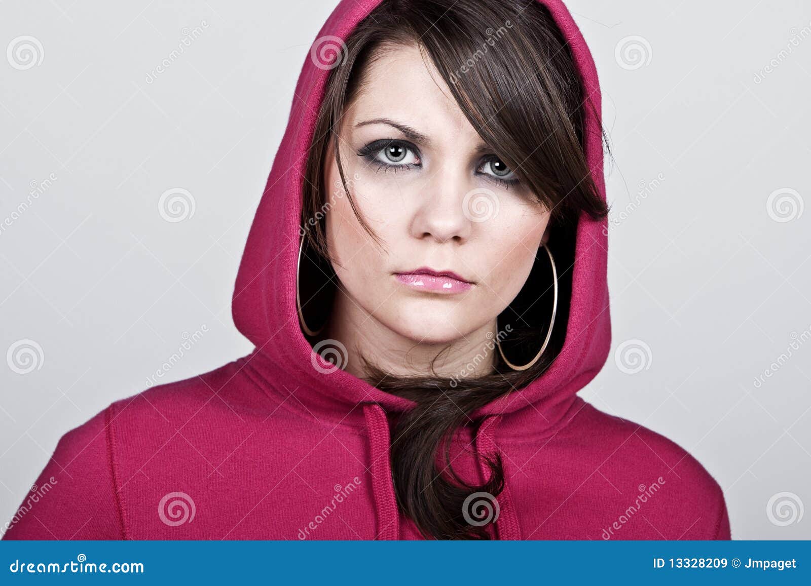 female hoodie against grey background