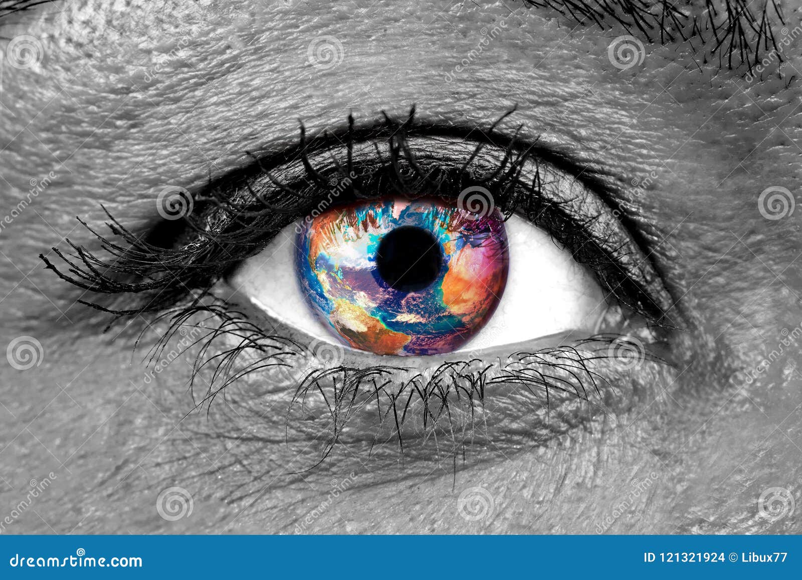 female human eye closeup with earth impressed on the iris