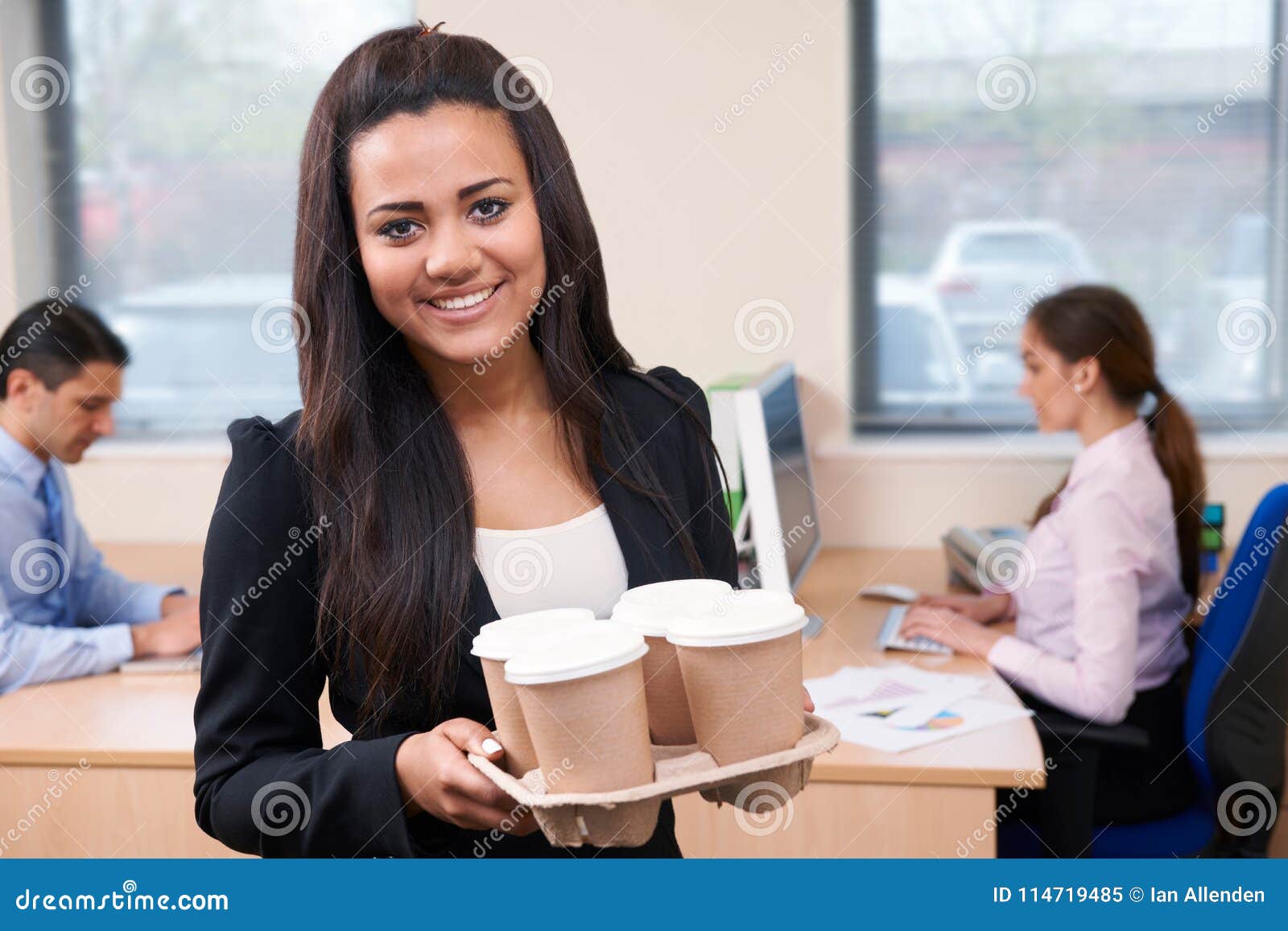 female intern fetching coffee in office