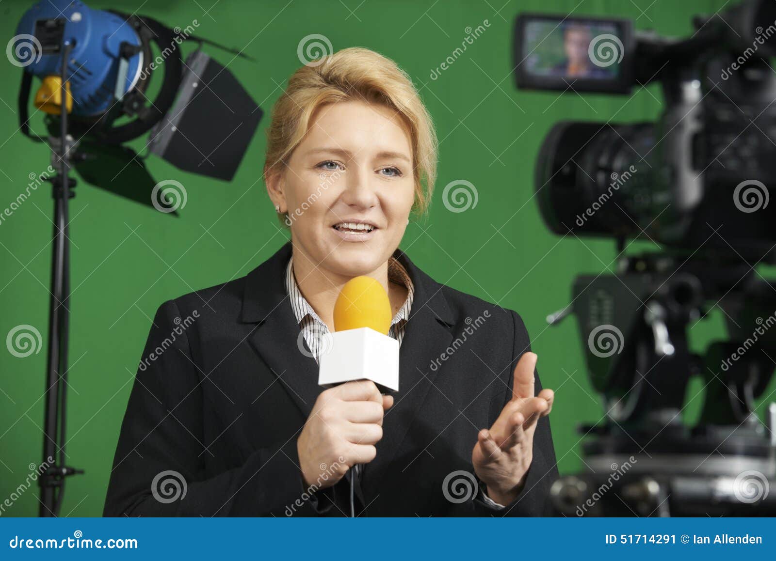 female journalist presenting report in television studio