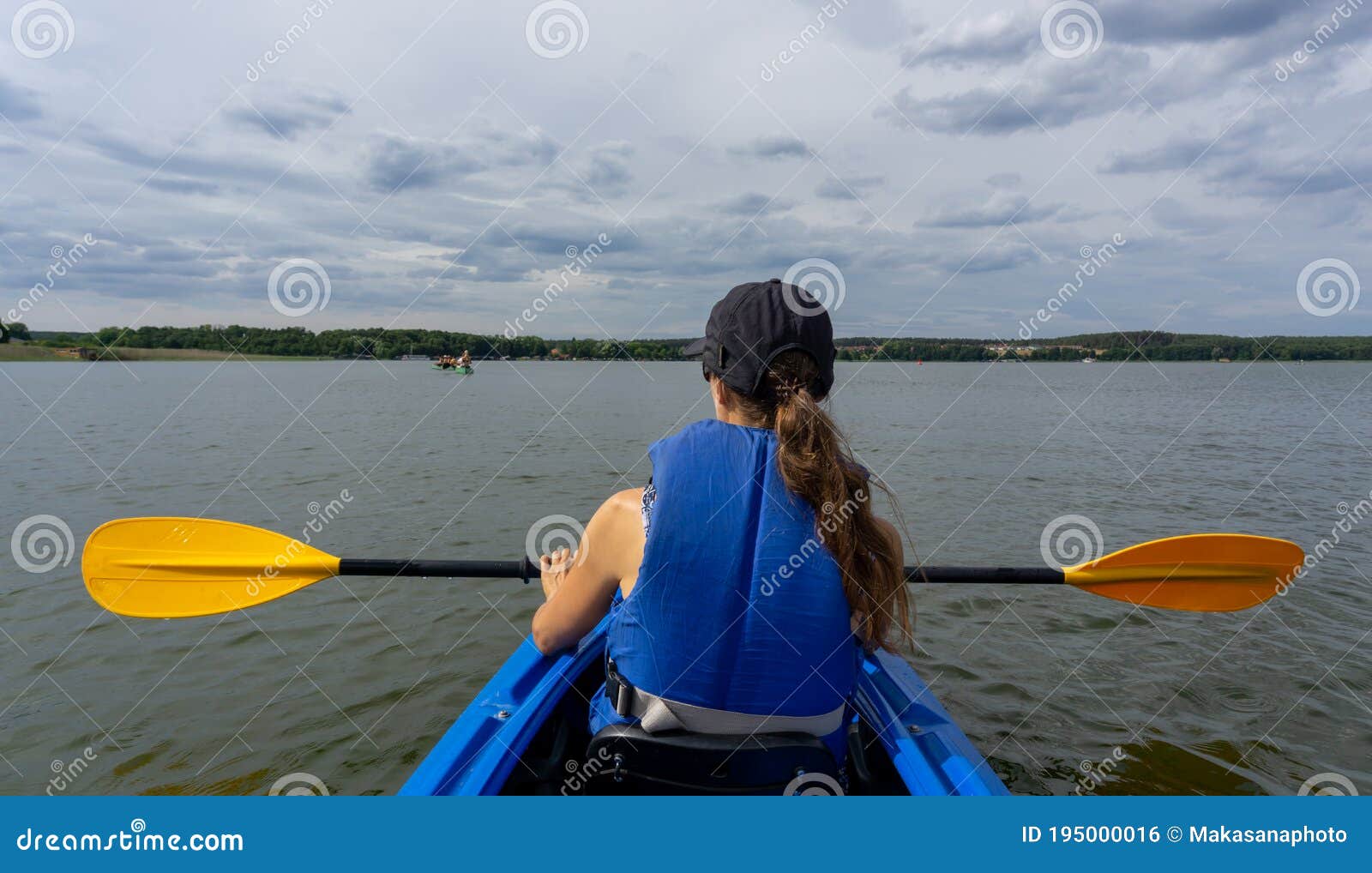 Female Kayaker on Lake Woblitz Enjoys a Day on the Water Stock Photo ...