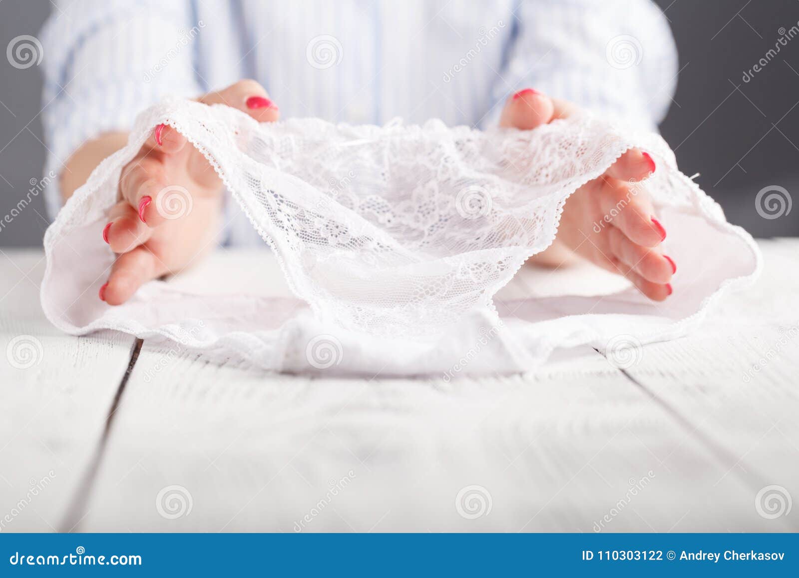 Female Lace White Panties in Hand on White Background Stock Photo ...